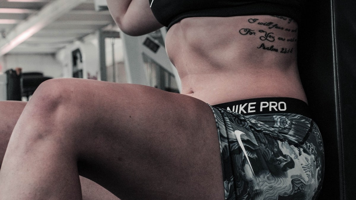 woman wearing gray and white Nike Pro shorts